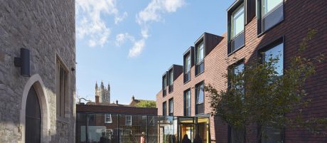 Modern accommodation building next to historic building in Canterbury