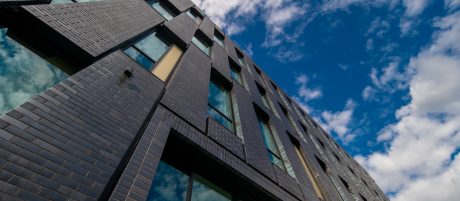 View of dark grey Corium brick tile facade on modern building