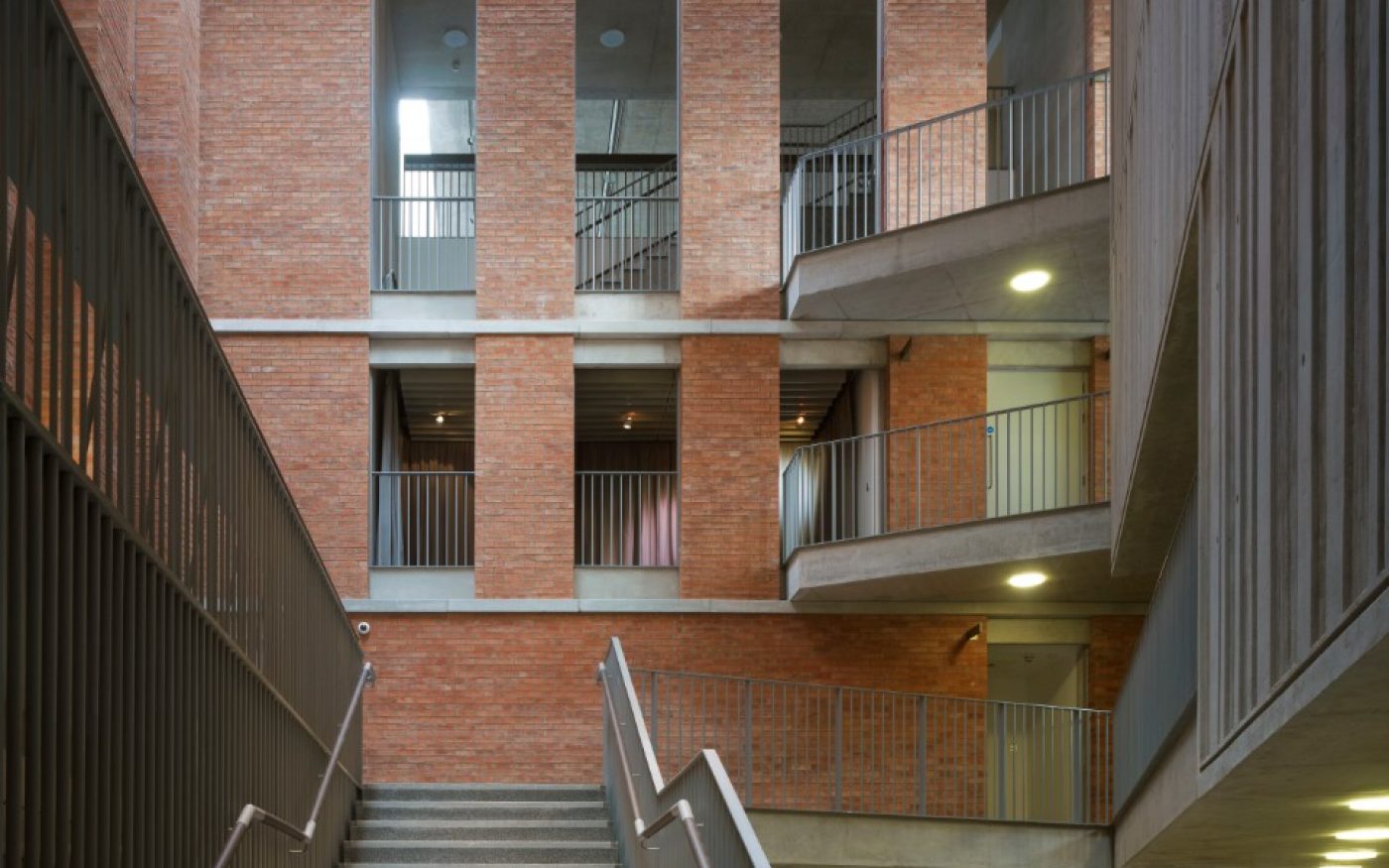 staircase within the MAC building showcasing the exposed brick