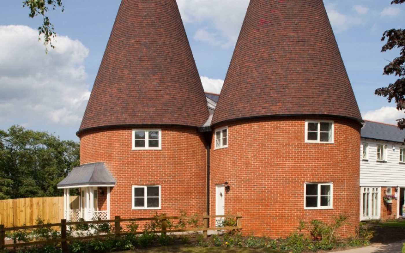Renovated roof on traditional red brick oast house