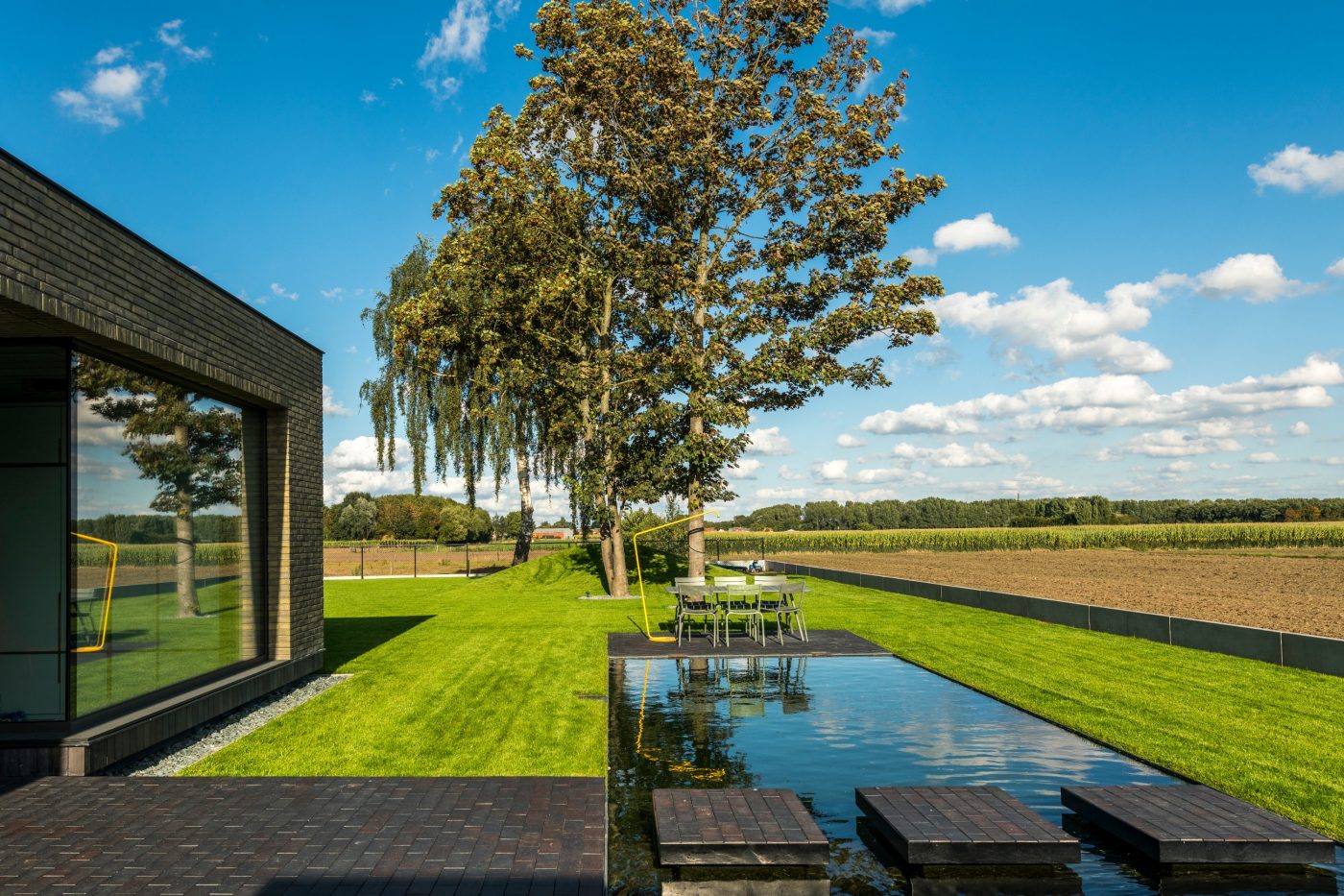 Beautiful landscaped garden with pool and stepping stones