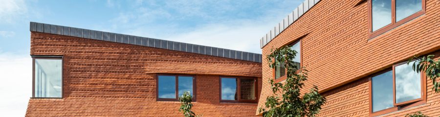 Keymer Churchill Shire Red tiles was used to transform this College using a brick cladding system solution.