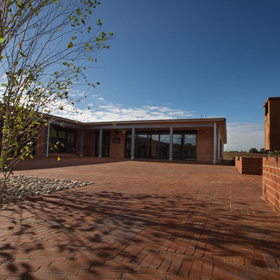 Exterior of Birmingham Dogs Home with clay paved area