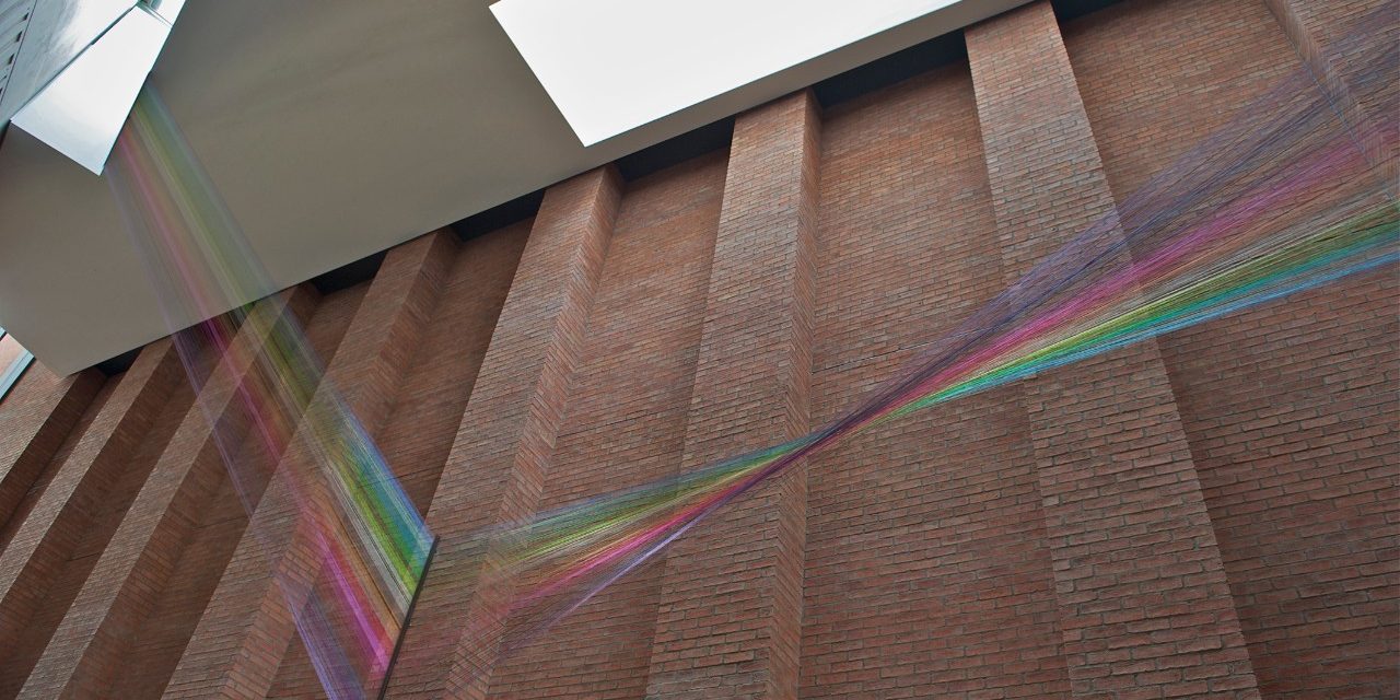 Interior of Metropolitan Arts Centre with brick walls and large sky light