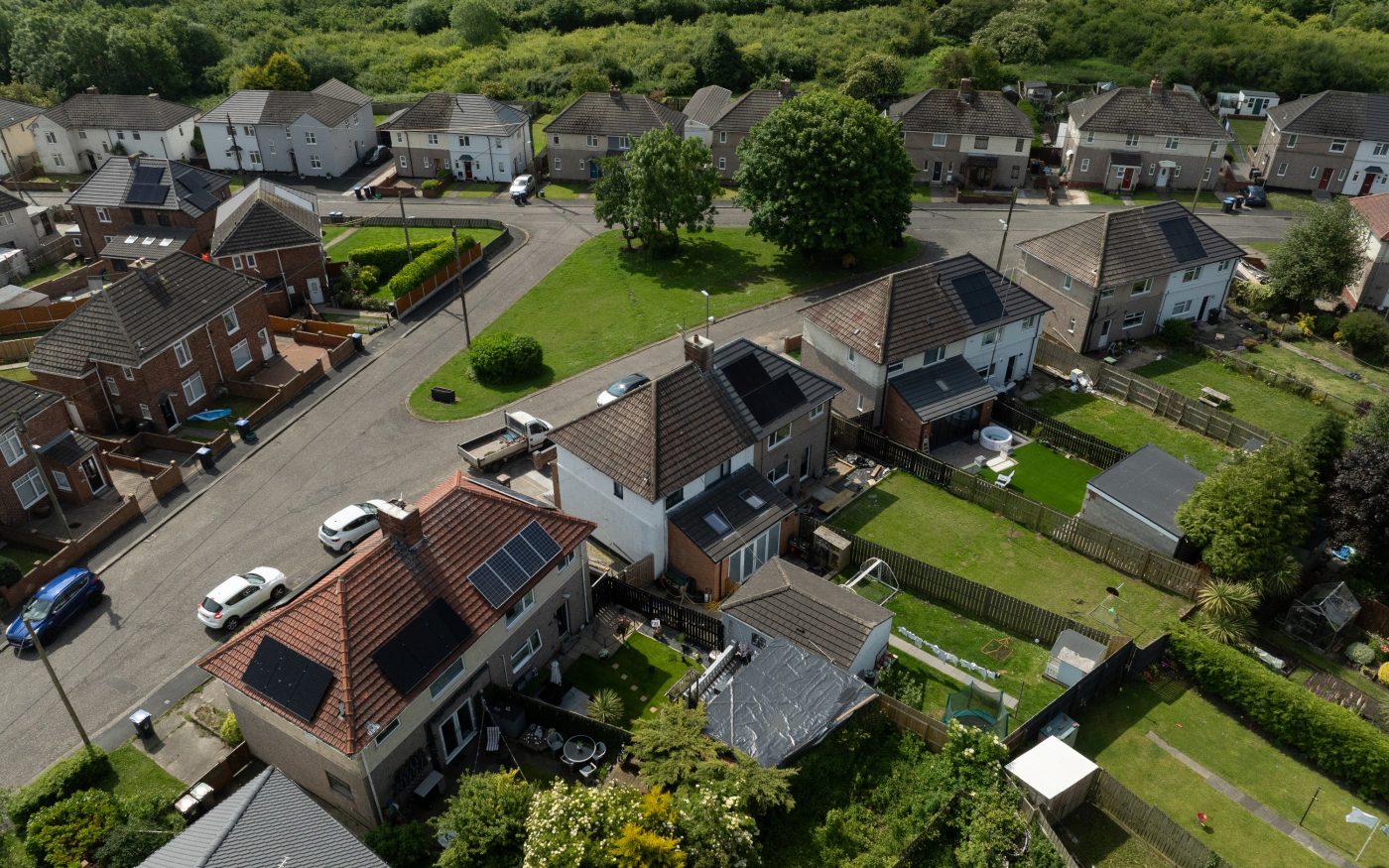 semi detached homes with solar panels on the roof