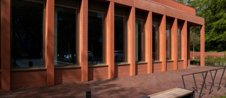 mutliple tall windows with clay red columns