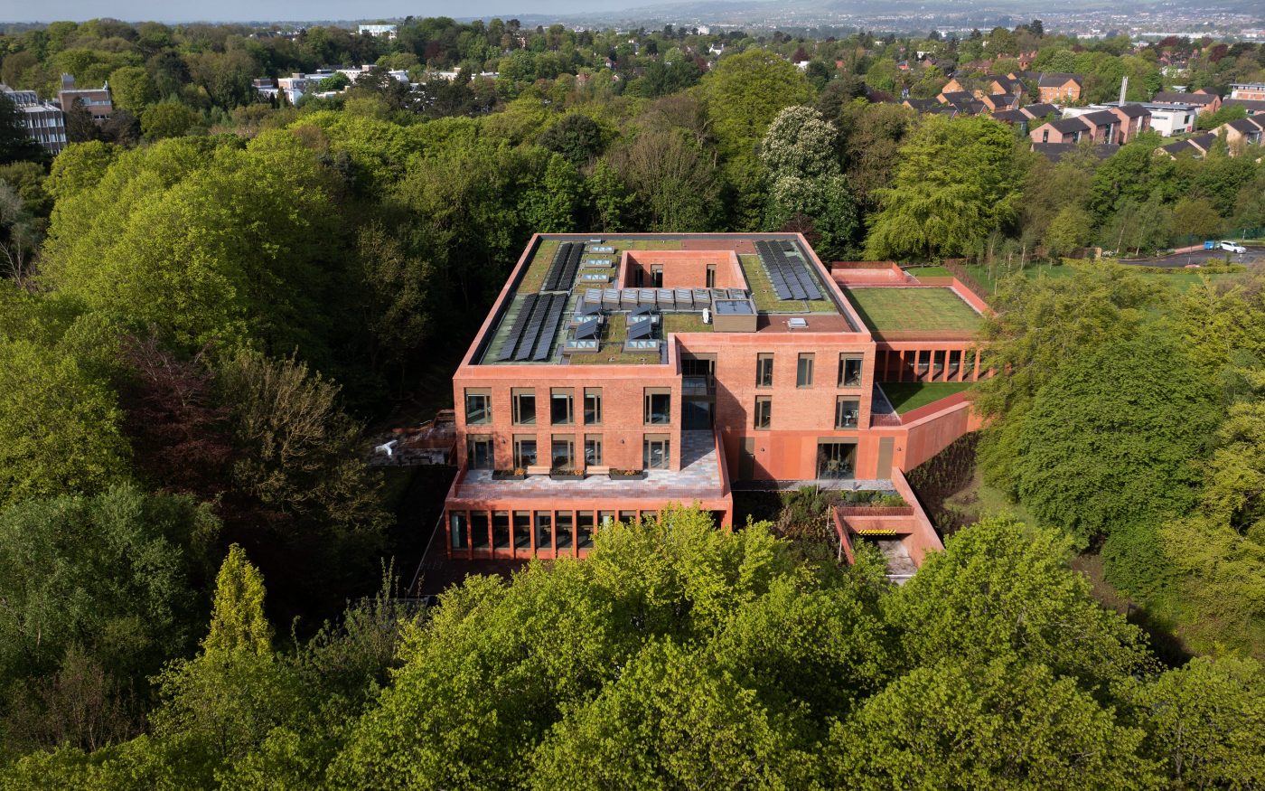 Aerial shot showing building that uses Wienerberger's Mellow Red Sovereign Stock brick, surrounded by trees