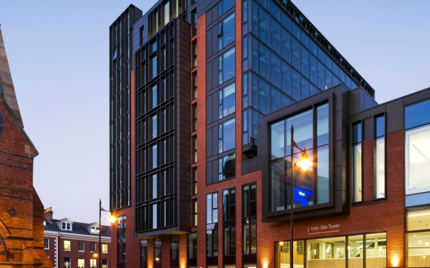 Large university building with brick walls and large windows