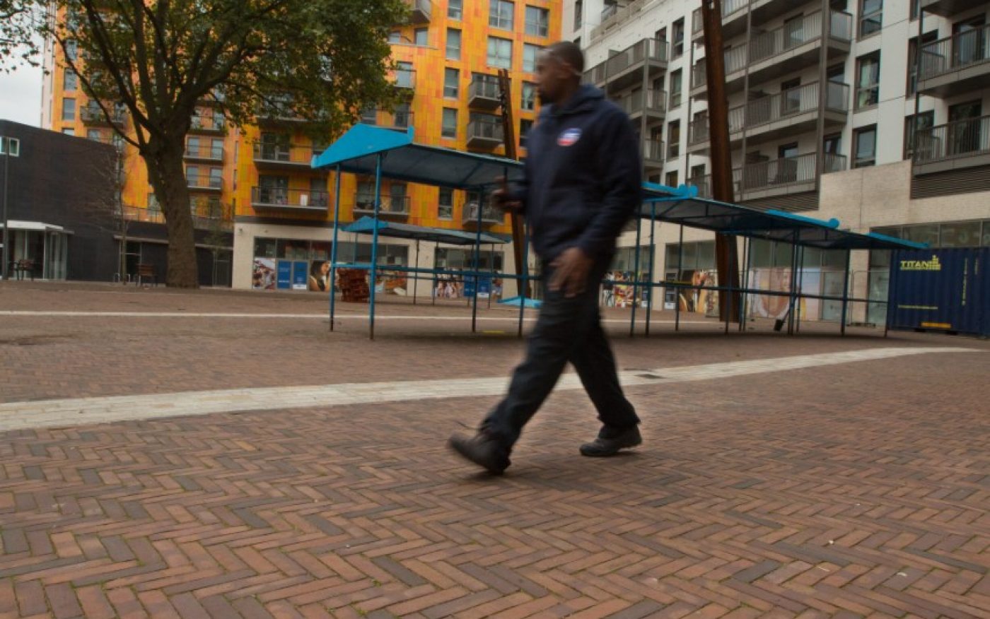 Up close image of a man walking through the market