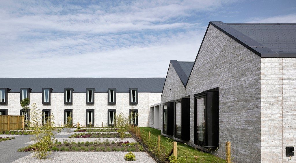 Exterior of modern respite home and landscaped garden