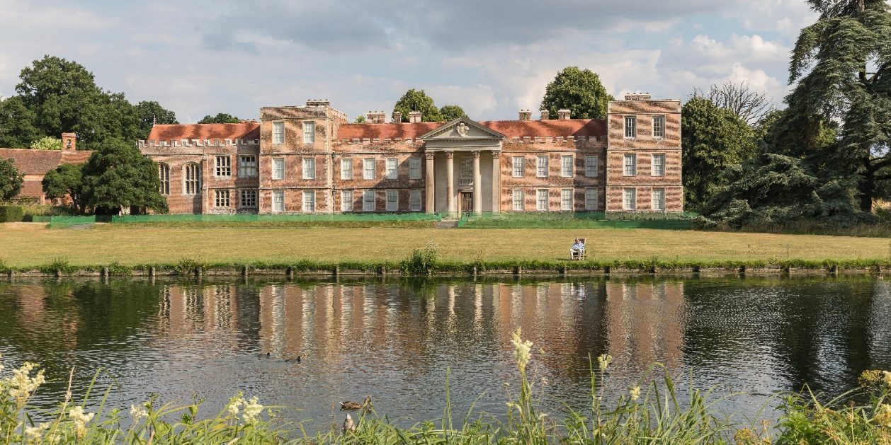 The Vyne Tudor mansion with lake in foreground