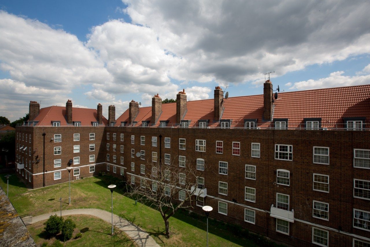 Multi-storey residential social housing with red roof tiles