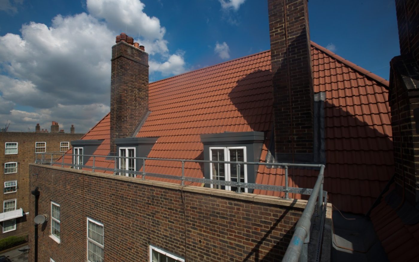 Sandtoft's red roof tiles on multi-storey houses