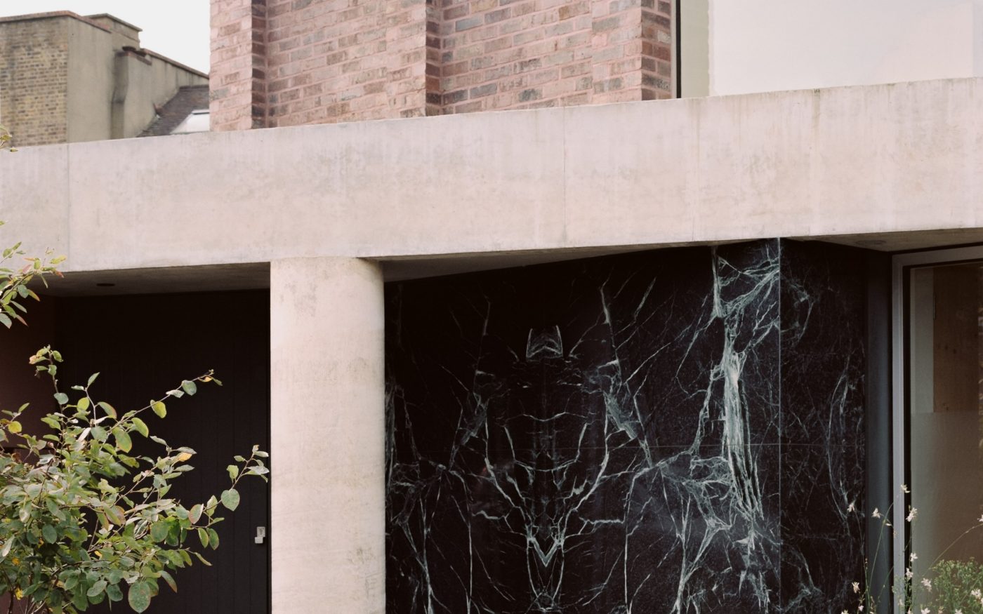 Details of black marble wall details at the front of the house