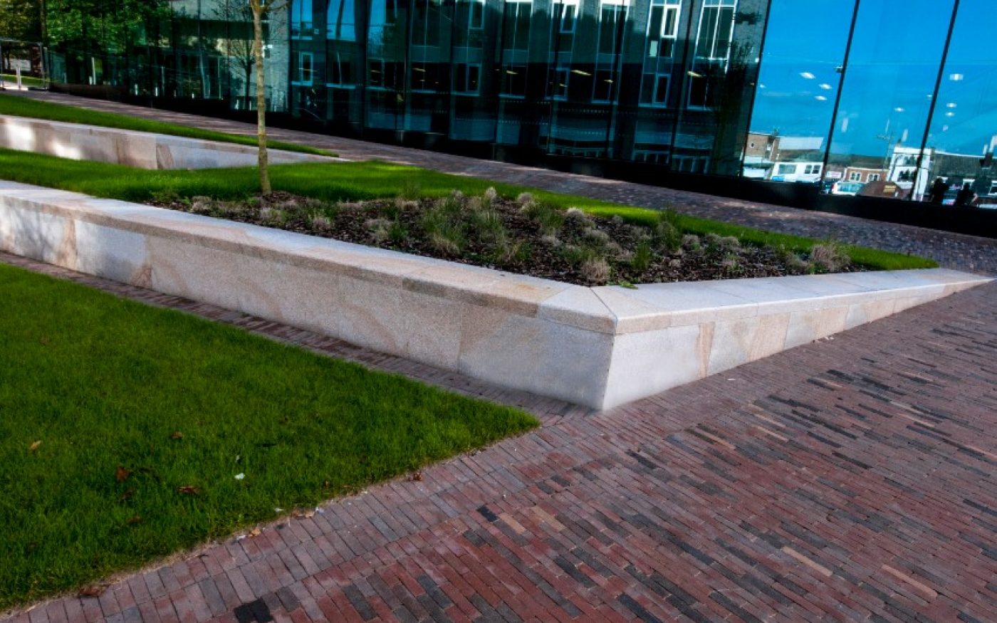 Red clay paving with grass space around