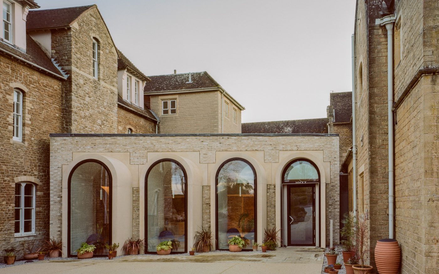 Exterior of building showing Wienerberger Marziale bricks and 4 arched tall windows