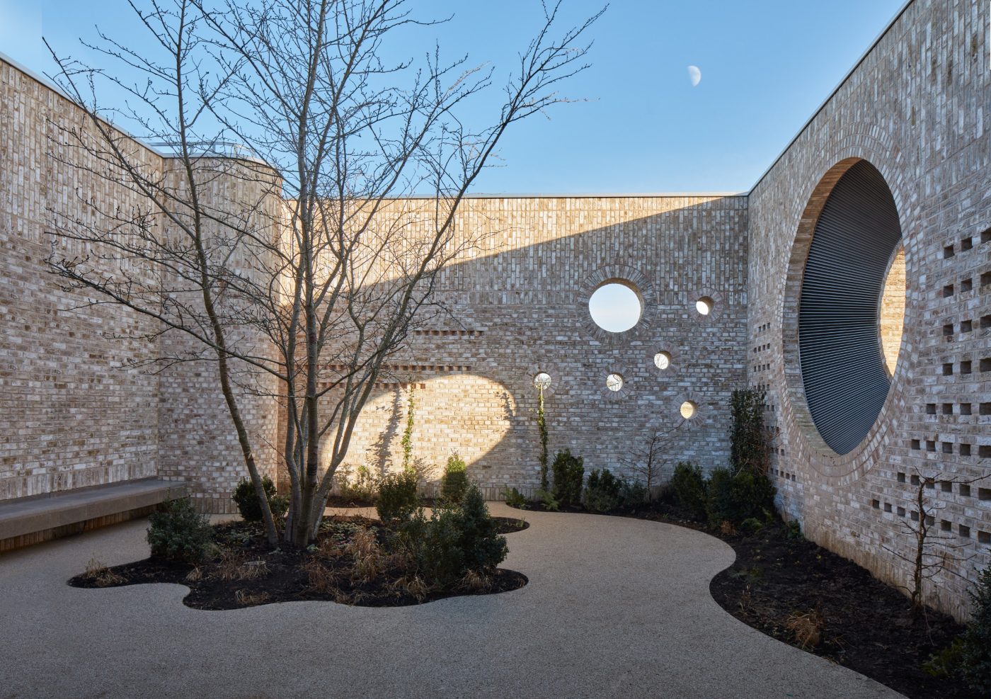 Detailed and beautiful courtyard area with circular shapes included in the brickwork