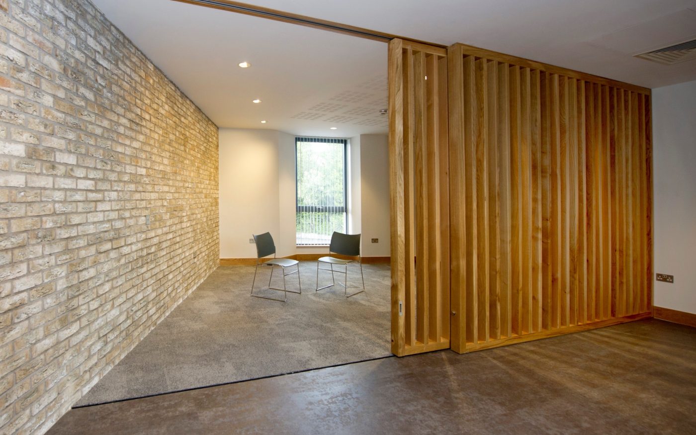 Internal view of exposed brick wall in the Junction building