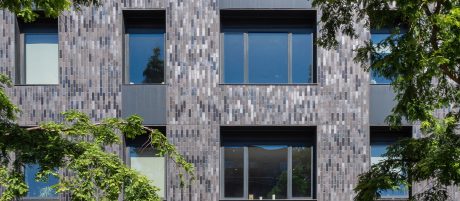 Close up details of the grey corium brick on the exterior of the building