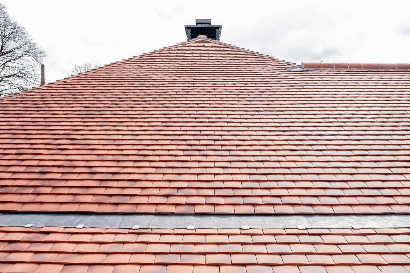red roof restored after deterioration over the years