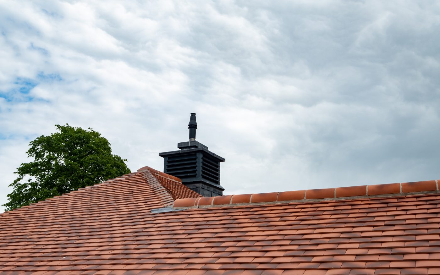 image of humber flander roof tiles with black chimney