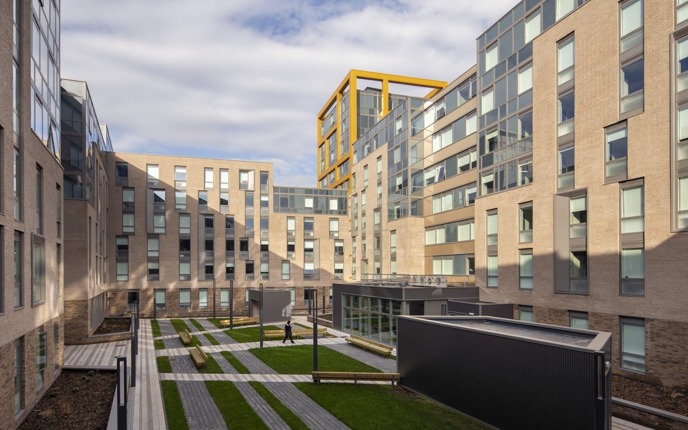 Large student accommodation building with landscaped courtyard