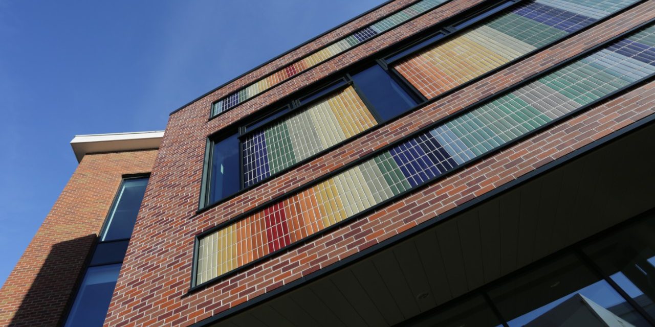 Exterior of building with rainbow facade pattern