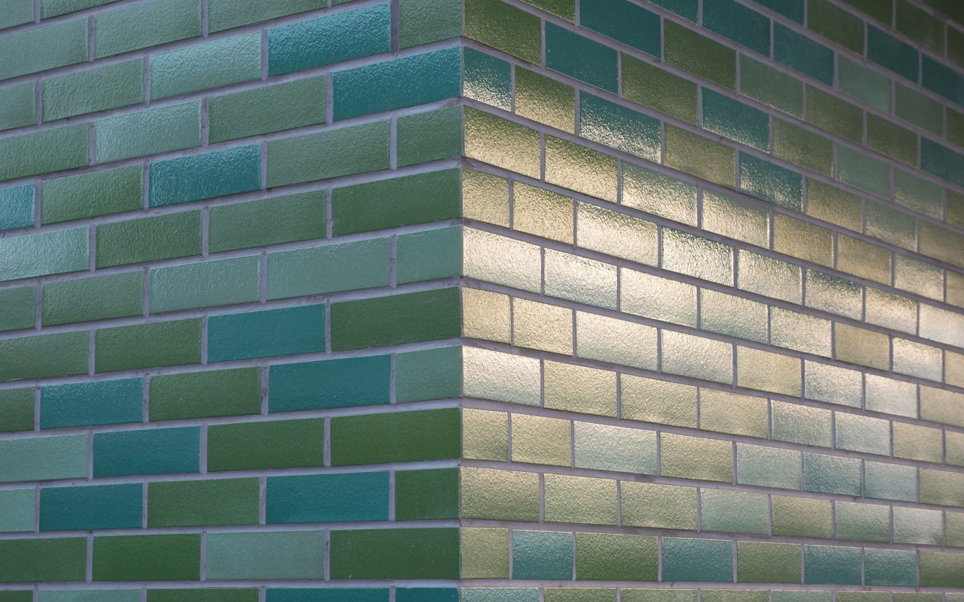 Green glazed Corium brick tiles in three shades