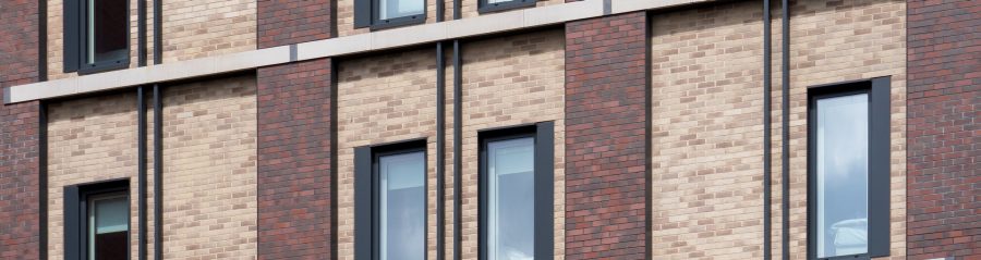 Corium brick tiles in two colours on hotel building