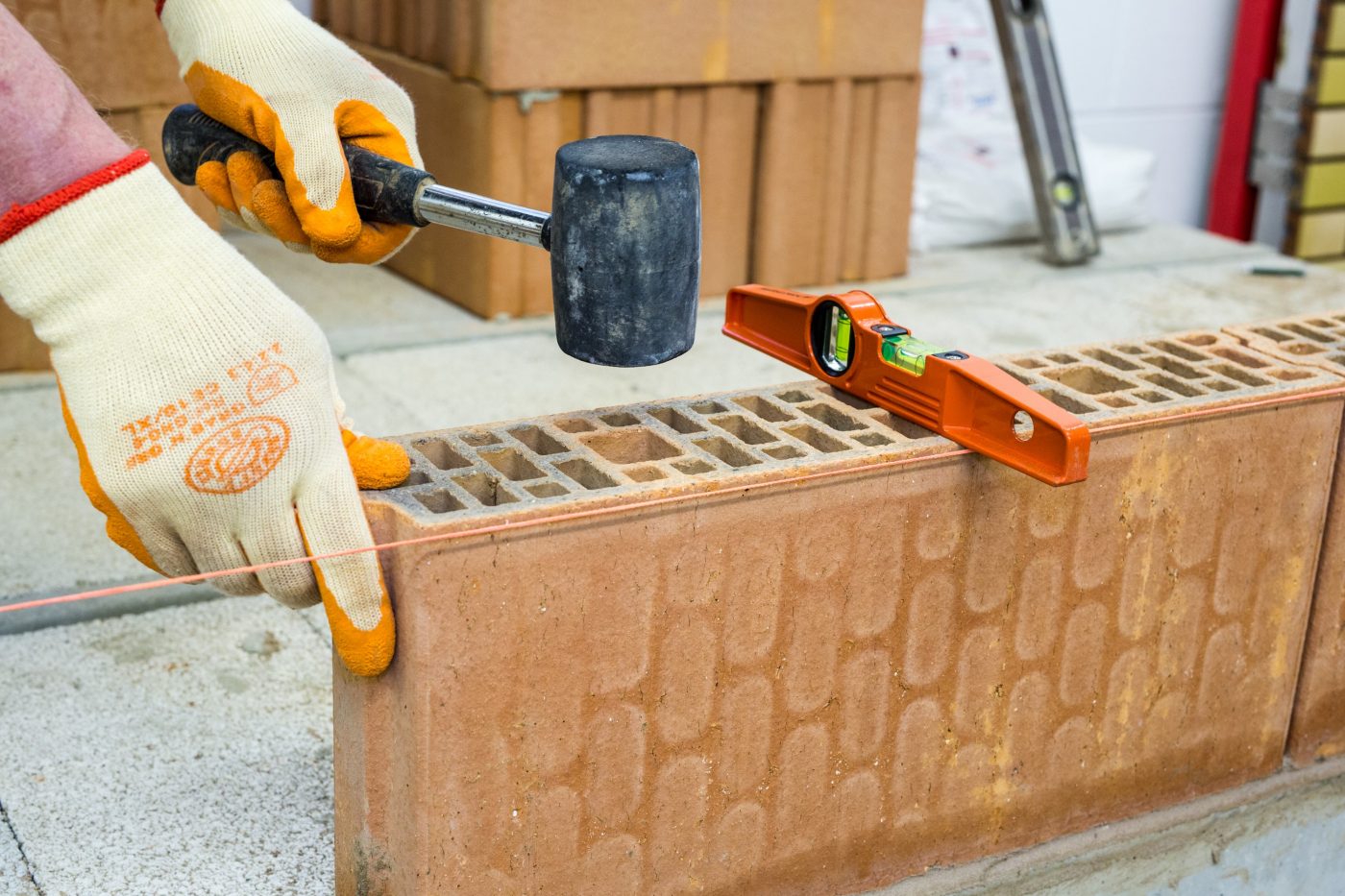 Tradesperson laying Porotherm clay block