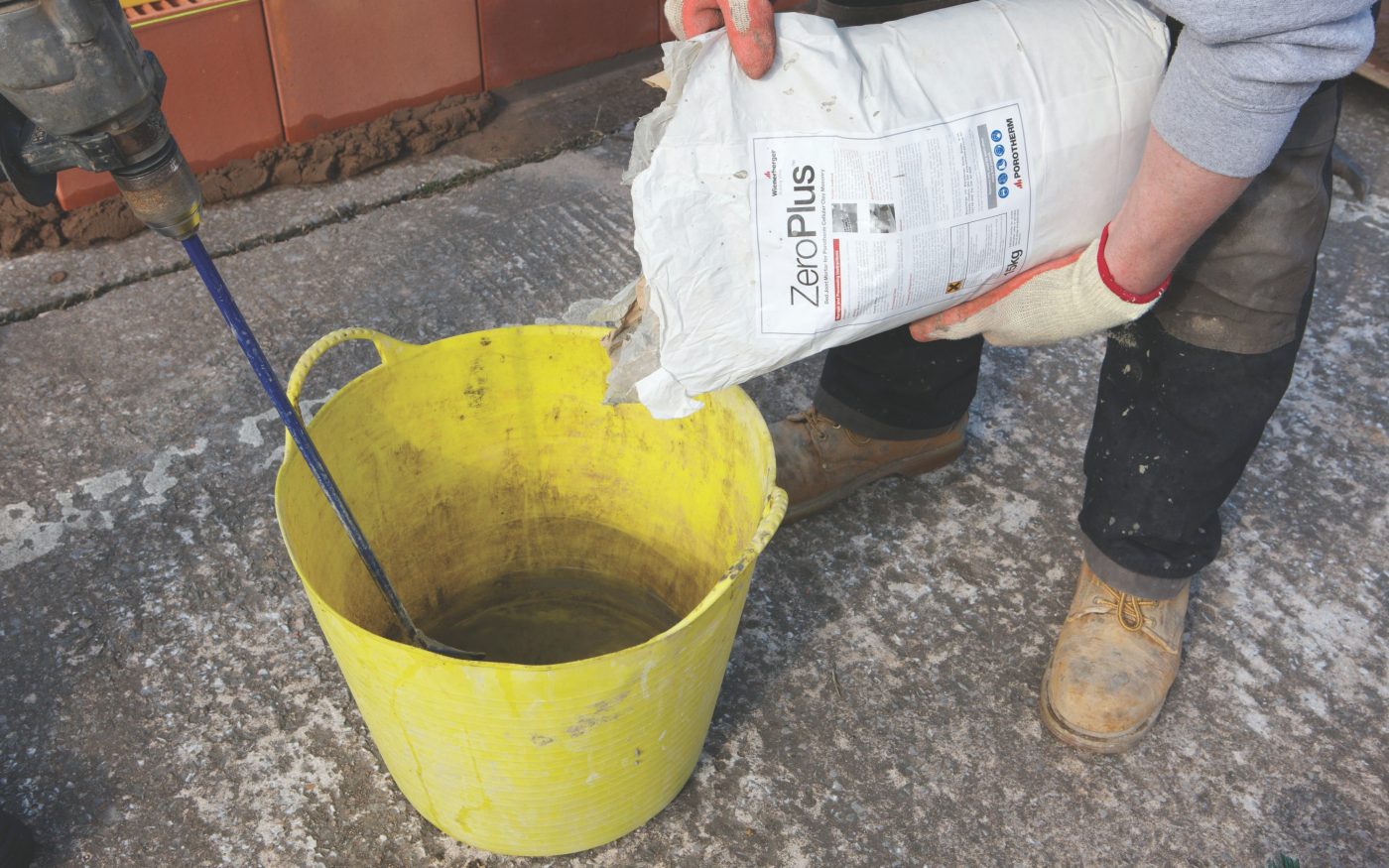 Man mixing mortar on construction site
