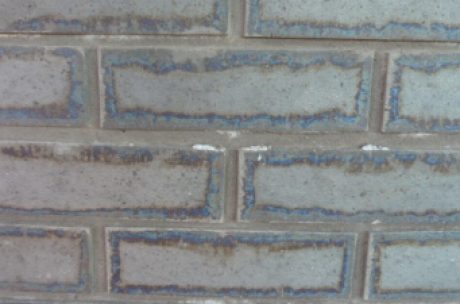 Picture framing appears around the edge bricks