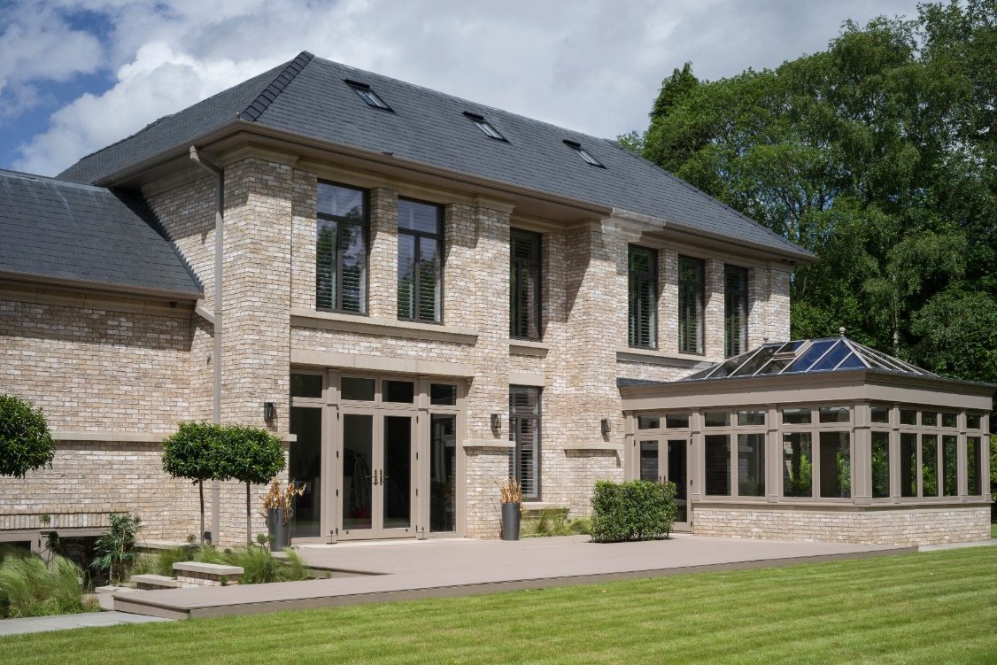 Large contemporary brick house with conservatory