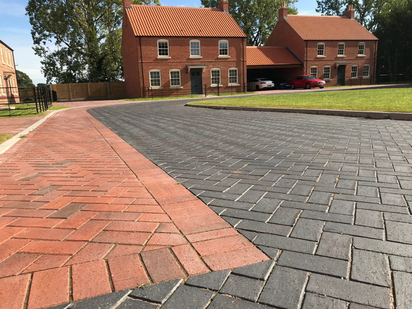 Mix of red and dark grey pavers used for new driveway