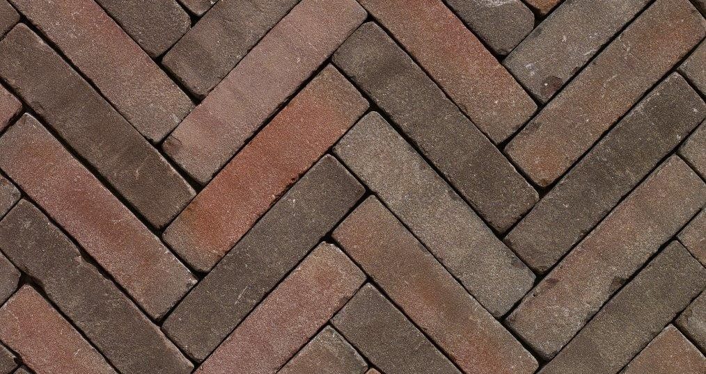 Close up of herringbone red clay pavers