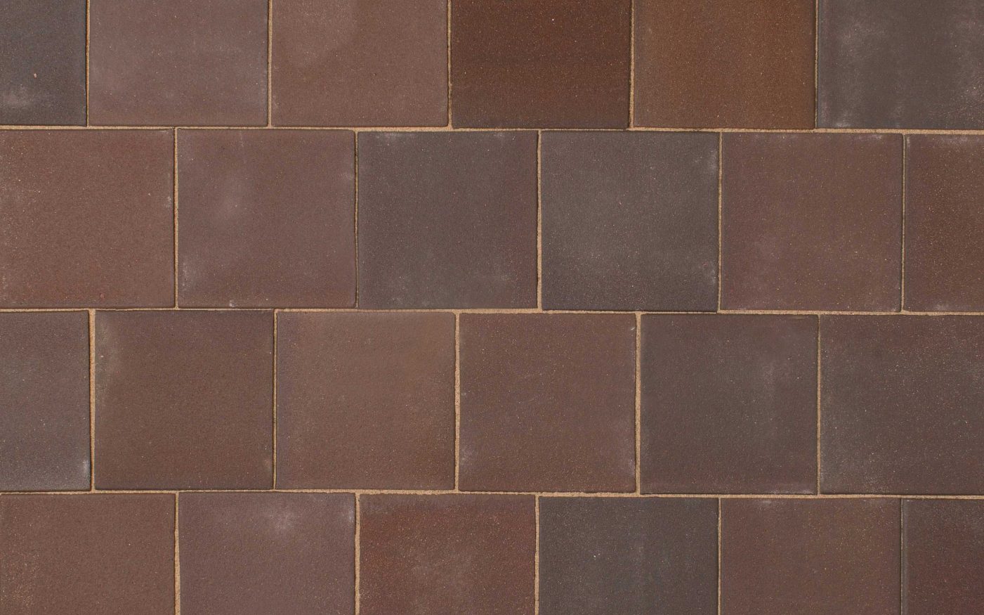 Smooth square red mutli toned clay pavers up close