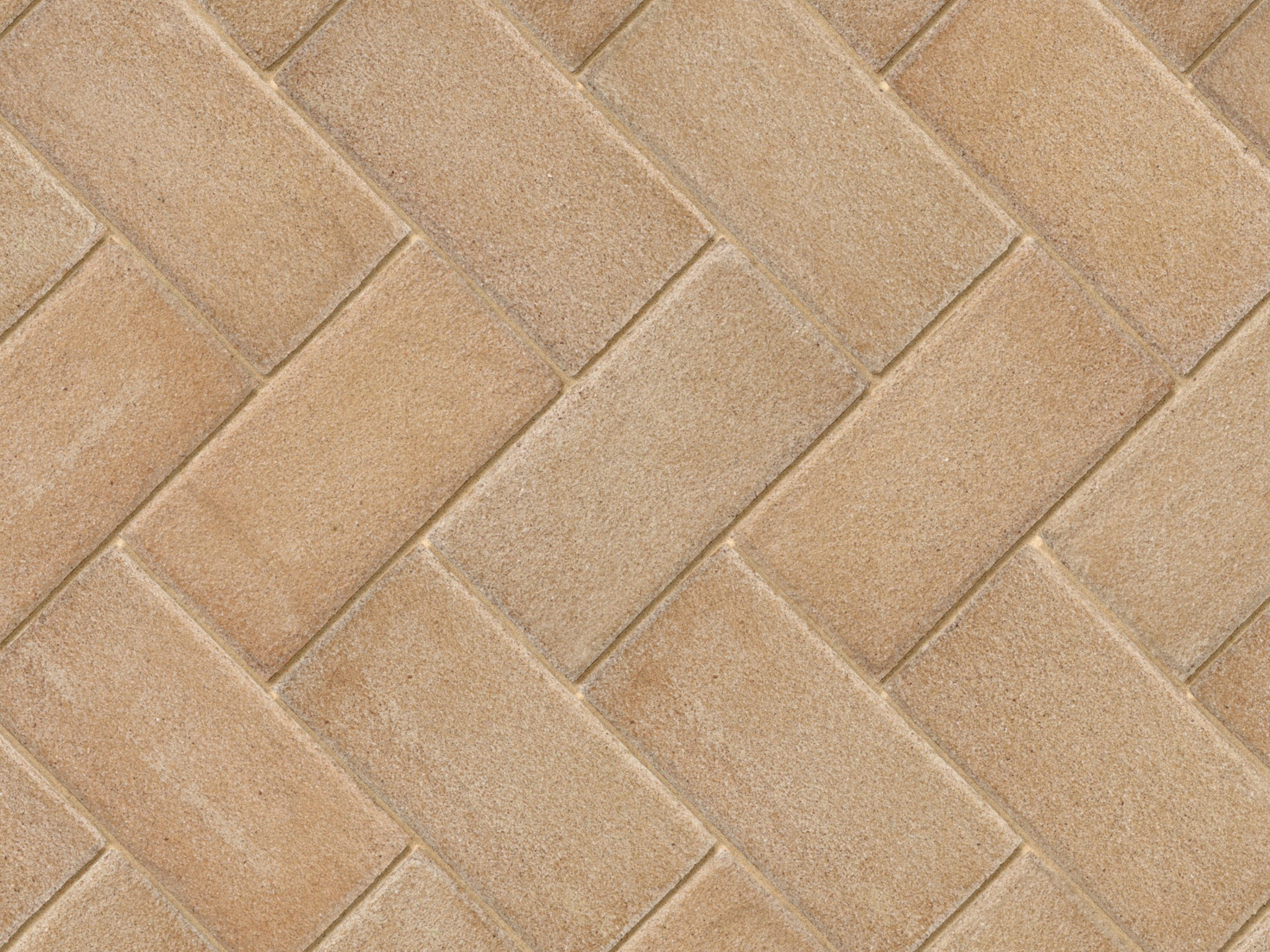 Buff colour pavers in a herringbone style close up