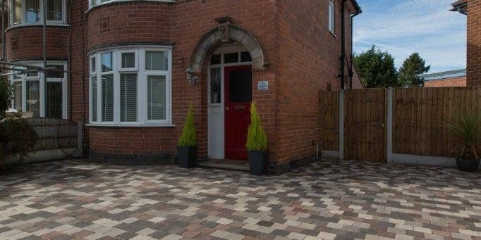 House with blended paver driveway