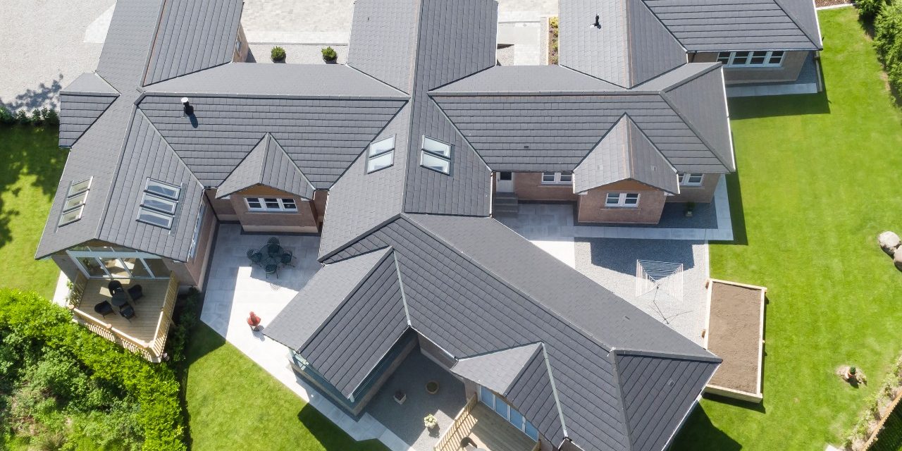 Birds-eye view of a large complex with an all grey roof