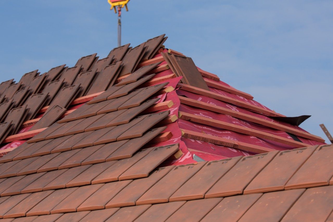 Roof tiles being installed