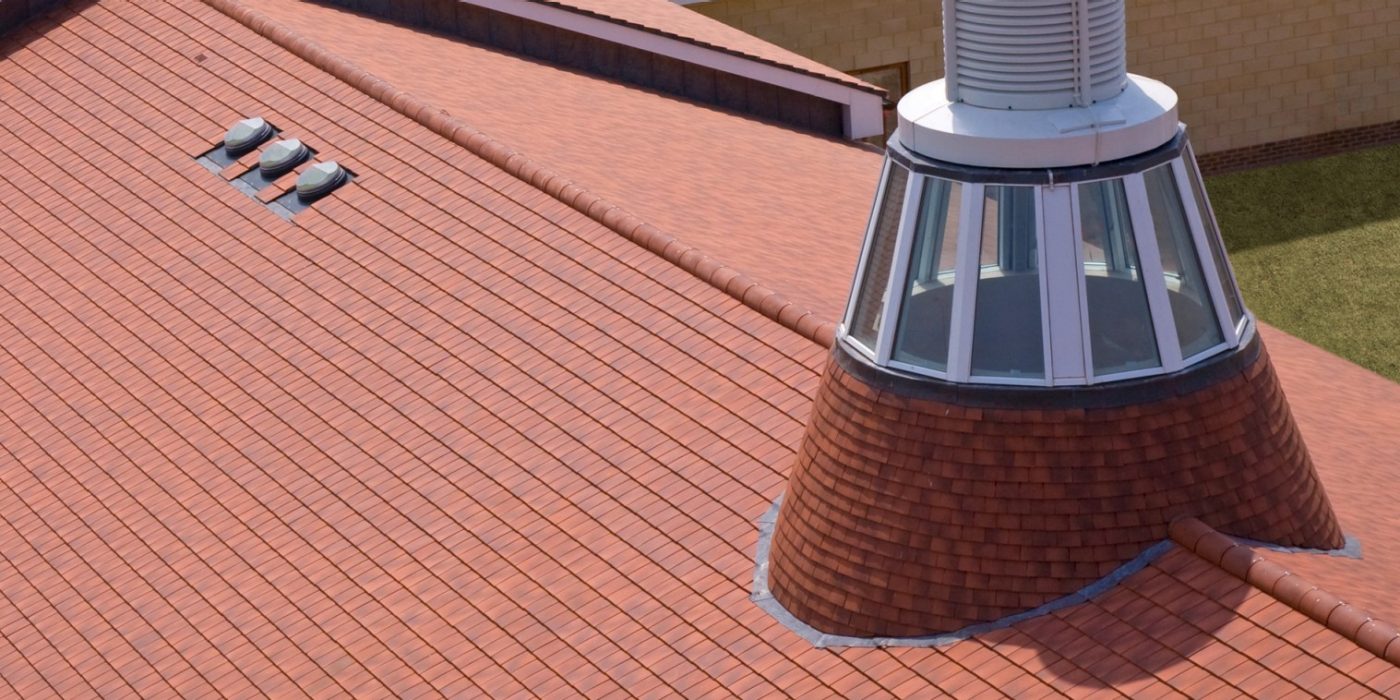 An image of low pitch roofing used on Hadlow College.