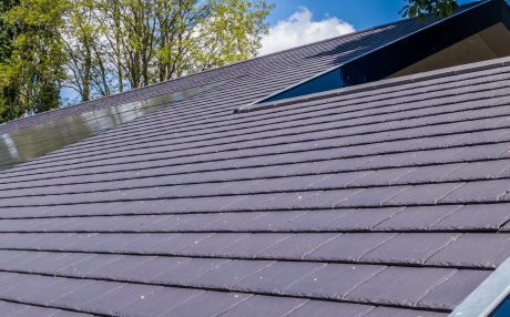 Grey large format roof tiles on new modern roof