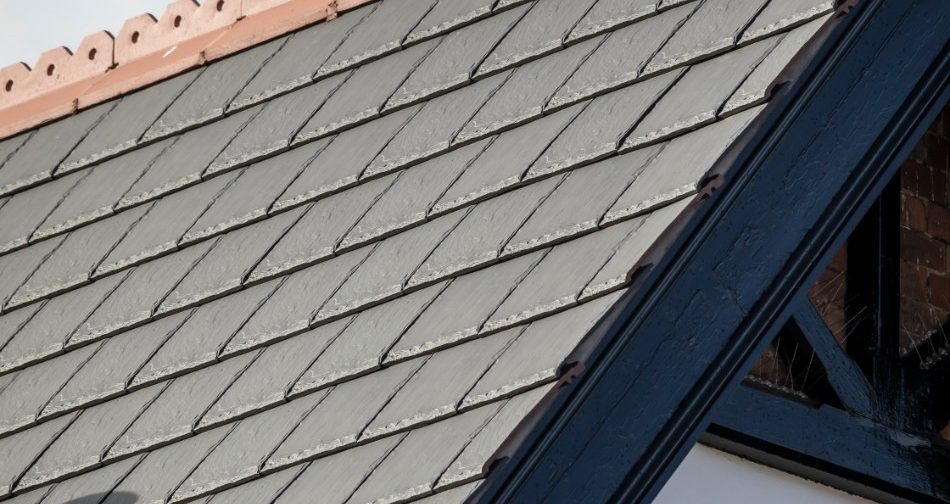 Red clay tiled roof on a brick house