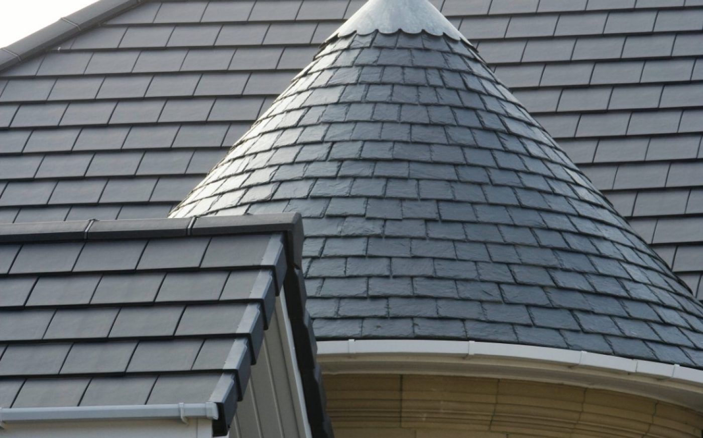 Grey slate roof with conical turret detail