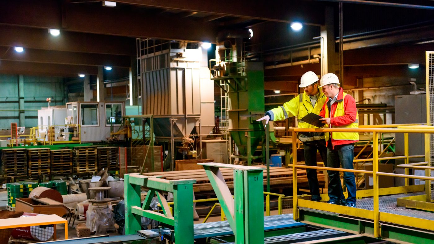 Engineers monitoring a clay block production