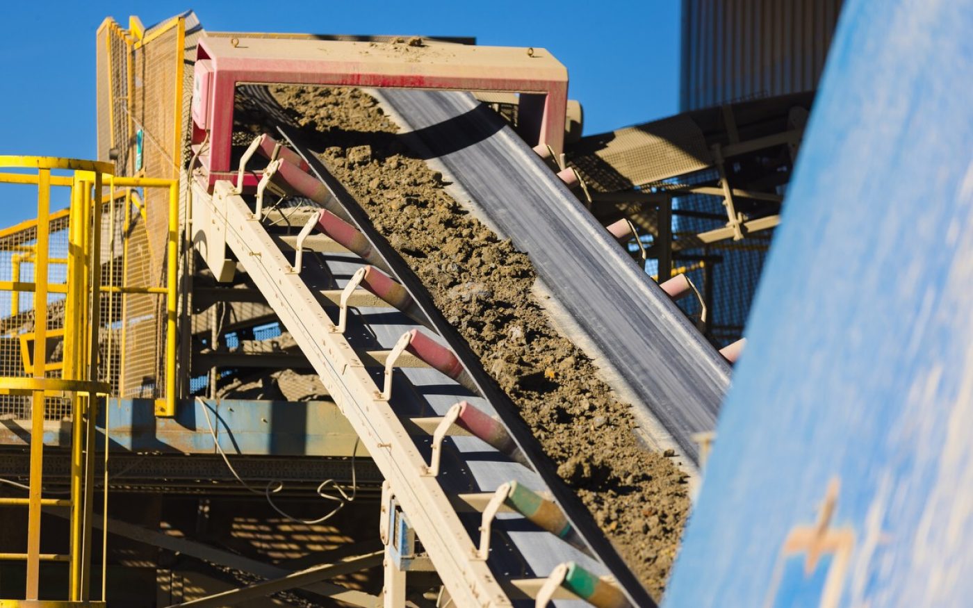 Clay moving up conveyor belt